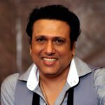 Indian Bollywood actor Govinda (R) smiles during a promotion for upcoming Hindi film Deewana Main Deewana, directed by  K.C. Bokadia in Mumbai on January 28, 2013. AFP PHOTO/ STR        (Photo credit should read STRDEL/AFP/Getty Images)